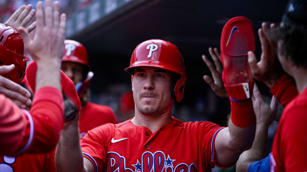 Sep 17, 2023; St. Louis, Missouri, USA; Philadelphia Phillies catcher J.T. Realmuto (10) is congratulated by teammates after scoring against the St. Louis Cardinals during the fourth inning at Busch Stadium. Mandatory Credit: Jeff Curry-USA TODAY Sports  